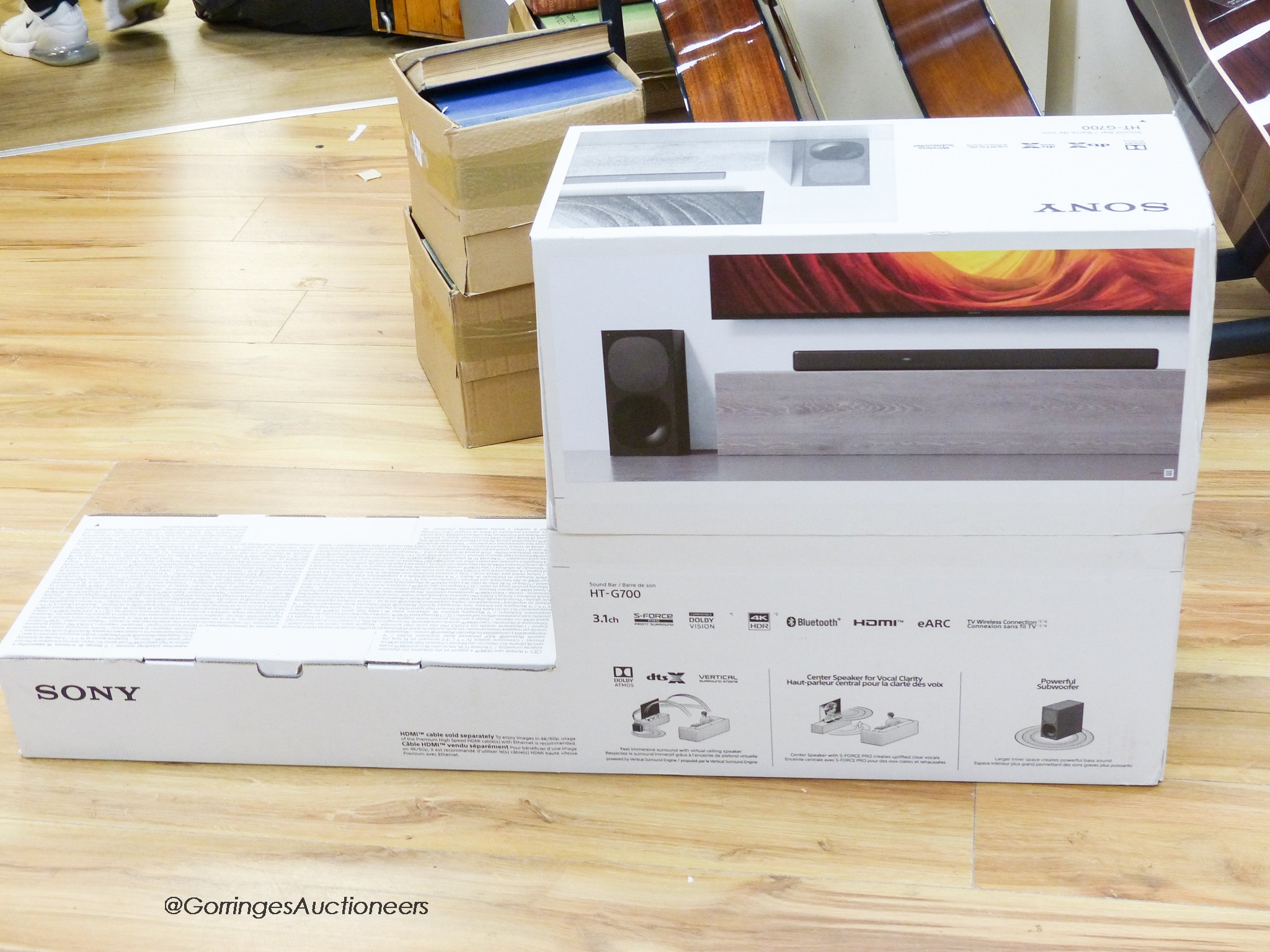 An unopened Sony Bravia X9J 50 television with sound bar